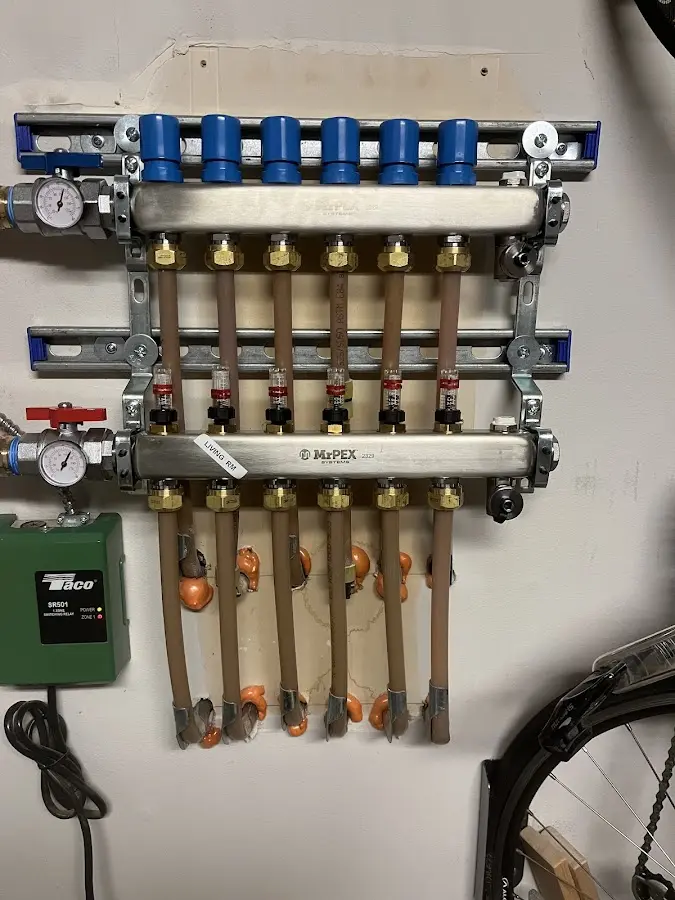 Plumber performing Water Heater Repair at a residential property in Orion